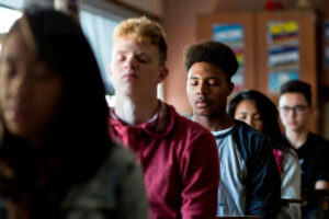 Tony Grandberry (center) and his classmates at Phillip and Sala Burton Academic High School practice Transcendental Meditation during a Quiet Time at the school in San Francisco, Calif., on Thursday, November 5, 2015. The school has two 15-minute Quiet Time breaks a day where students either meditate or read. The program has helped reduce stress at the school, which is located in the low-income Visitacion Valley neighborhood.